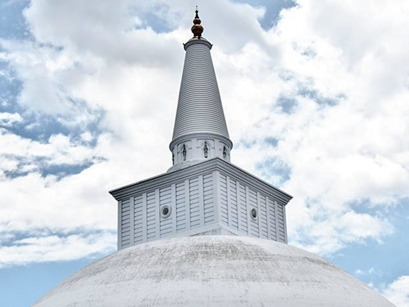 Temple Stupa in Anuradhapura with a cloudy sky